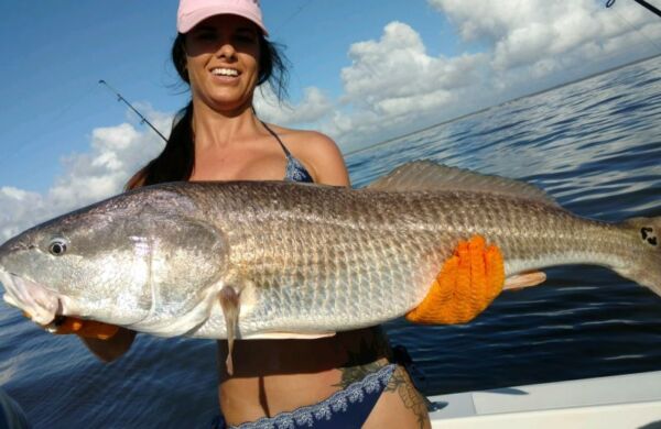 girl with giant redfish